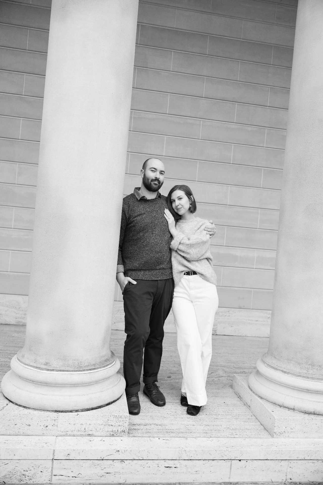 Kendall and Adrian beneath the columns